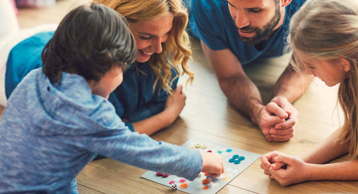 family playing board game at home