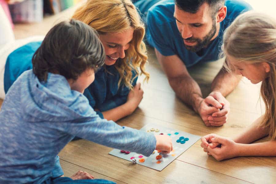 family playing board game at home